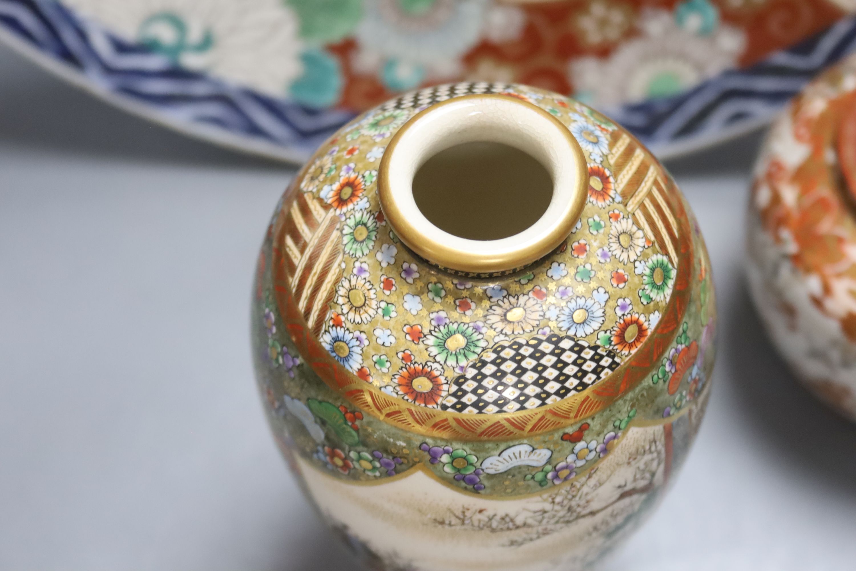 A Japanese Imari charger, a Kutani jar and cover and a Satsuma vase, diameter 40cm